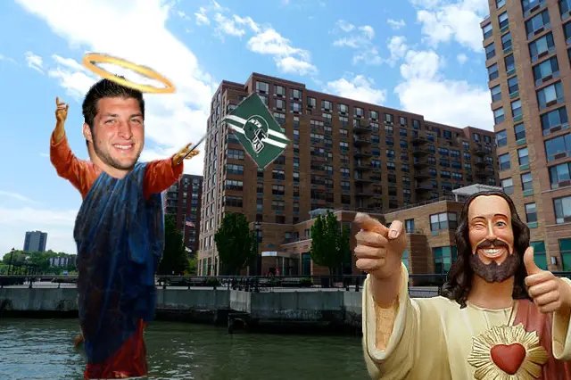 Tim Tebow in front of his new home